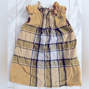 Burberry check toddler girls dress in yellow, gray, and white.